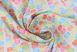 Swirled swatch bright popsicles fabric (white fabric with lines of popsicles in bright colours of the rainbow)