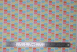 Flat swatch bright popsicles fabric (white fabric with lines of popsicles in bright colours of the rainbow)