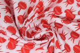 Swirled swatch bbq season red fabric (white fabric with medium red bbqs allover)