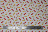 Flat swatch ketchup & mustard fabric (off white fabric with tossed cartoon bottles of ketchup and mustard in red and yellow)