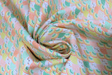 Swirled swatch Seigaiha fabric (small scalloped shape fabric in white and rainbow colours with little faces in white spaces)