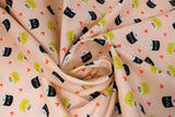 Swirled swatch Maki Love fabric (pale pink fabric with tossed black and beige maki sushi rolls with kawaii style faces and tossed hearts)