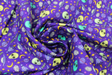 Swirled swatch Alien Invasion fabric (bright purple fabric with tossed green shades alien heads and space related emblems allover: UFOs, moons, stars, etc.)