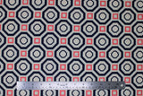 Flat swatch Sococo fabric (white fabric with concentric navy octagon shapes and pink squares creating alternating geometric pattern allover)