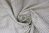 Swirled swatch Gold Lines White fabric (white fabric with alternating diagonal rectangles in gold with sparkle/metallic effect comprising herringbone/brick like chevron pattern allover)