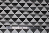 Flat swatch Mirrored fabric (white fabric with black and grey/white marl upside down triangles with jagged edging alternating in stripes to create geometric pattern allover)