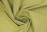 Swirled swatch Daisy Dot fabric (pale olive coloured fabric with small yellow daisies in dark olive circles allover)