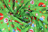 Swirled swatch play time toss fabric (lime green fabric with tiny tossed Elf elements including green christmas trees, brown gingerbread people, red reindeer, waving santas, elves, elf movie title with elf as l, etch-a-sketch, etc.)