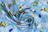 Swirled swatch movie moments fabric (light blue artic waters/icebergs cartoon look fabric with tossed movie related emblems and text "raised by elves" "bye buddy hope you find your dad" etc., tossed elf logo, polar bears, narwhals, penguins, etc.)
