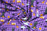 Swirled swatch Creepy fabric (purple gingham fabric with tossed black and grey trees, orange jack-o-lanterns, black cats, with Toto and Dorothy characters)
