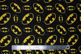 Flat swatch batman logo (black) fabric (black fabric with tossed yellow batman logo in various sizes)
