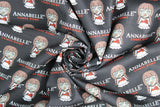 Swirled swatch Annabelle Logo fabric (black fabric with illustrative annabelle doll and movie title)