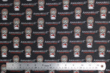 Flat swatch Annabelle Logo fabric (black fabric with illustrative annabelle doll and movie title)