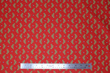 Flat swatch Wonder Woman fabric (red fabric with gold WW logo and white stars tossed allover)