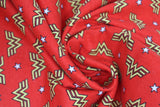 Swirled swatch Wonder Woman licensed printed fabric (logo on red)