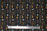 Flat swatch licensed DC Comics printed fabric in Retro Action (superman logo and zoom cartoon on black)