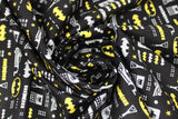 Swirled swatch batman icons fabric (black fabric with tiny tossed batman related emblems in grey and yellow, batman logos, beakers, batmobile, etc.)