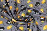 Swirled swatch halloween kawaii fabric (grey fabric with tossed kawaii style batman characters in various poses, tossed orange jack-o-lanterns, tossed black bats)