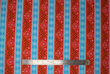 Flat swatch fair isle fabric (christmas sweater look fabric with red and blue alternating stripes, blue stripes contain white and darker blue snowflakes, red stripes include wonder woman W and white snowflakes and ornaments)