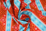 Swirled swatch fair isle fabric (christmas sweater look fabric with red and blue alternating stripes, blue stripes contain white and darker blue snowflakes, red stripes include wonder woman W and white snowflakes and ornaments)