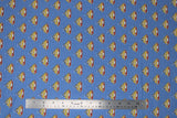 Flat swatch licensed DC Comics printed fabric in Retro Logo (tiled multi-coloured superman logo on blue)