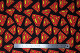 Flat swatch superman logo (black) fabric (black fabric with tossed red and yellow superman logo in various sizes)