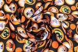 Swirled swatch character coins fabric (black fabric with orange circular badges allover with full colour characters within, tossed orange basketballs and "Tune Squad" text)