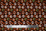 Flat swatch character coins fabric (black fabric with orange circular badges allover with full colour characters within, tossed orange basketballs and "Tune Squad" text)