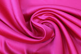 Swirled swatch fuchsia satin fabric