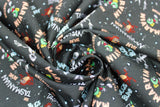 Swirled swatch Retro Characters fabric (black fabric with tossed full colour looney tunes characters and names in blue and red with tossed star dots)