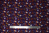 Flat swatch monster toss fabric (dark purple fabric with small tossed halloween and scooby doo emblems: bats, bones, pumpkins, pale faced Shaggys, vampire heads, scooby heads in various poses, "Ruh-Roh" and "Boo" text)