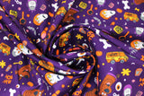Swirled swatch monster toss fabric (dark purple fabric with small tossed halloween and scooby doo emblems: bats, bones, pumpkins, pale faced Shaggys, vampire heads, scooby heads in various poses, "Ruh-Roh" and "Boo" text)