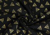 Swirled swatch Deathly Hallow Logo fabric (black fabric with tossed small gold deathly hallows triangle emblems allover)