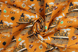 Swirled swatch Halloween Back Hogwarts fabric (orange fabric with 'Back to Hogwarts' text and tossed cartoon full colour emblems related to HP: brooms, glasses, etc.)