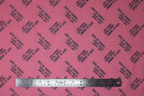 Flat swatch Talk Fast Stripe fabric (bubblegum pink fabric with thin diagonal white stripes and "Life is short, talk fast" "gilmore girls" text allover)