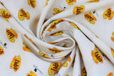 Swirled swatch Luke's Diner fabric (white fabric with tossed yellow Luke's diner sign coffee mugs and "Gilmore girls" text)