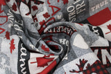Swirled swatch grey multi patchwork fabric (various sized rectangle and square patches in greys, red, black/red buffalo check with tossed Canada related emblems and text, moose, bear, leaves, etc.)