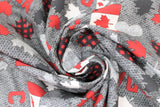 Swirled swatch flags, leaves fabric (grey knit look fabric with tossed red, white, black, grey Canada related emblems flags, leaves, hearts, and "Canada" text)