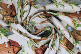 Swirled swatch outhouses fabric (white fabric with medium sized assorted wooden outhouses with small patches of greenery around)