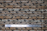 Flat swatch wood with stars fabric (horizontal grey brown wood planks look fabric with crescent moon and sun cut outs in black)