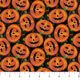 Flat swatch Pumpkin Toss fabric (black fabric with tossed jack-o-lanterns allover with green leaves)