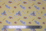 Flat swatch Tom & Jerry fabric (yellow fabric with tossed cartoon characters with white backgrounds, assorted cat and mouse poses, cheese slices, bats, "Best Foes Forever" text, etc.)