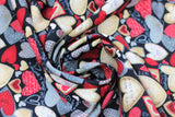 Swirled swatch Heart Toss fabric (black fabric with packed tossed hearts allover in red, greys, beige, white, etc. in various styles)