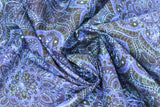 Swirled swatch of blue floral intricate design fabric (dark fabric with medium blue shades floral look mandala pattern)
