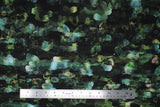 Flat swatch assorted floral printed fabric in emerald (dark green/black fabric with watercolour look horizontal abstract lines pattern in various green and blue shades)