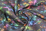 Swirled swatch assorted ethereal printed fabric in spectrum (multi-coloured with black background)
