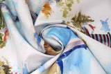 Swirled swatch shoreline printed fabric in bluff (pale white/blue fabric mimicking sky and water with lighthouses and cottages on rocks)