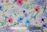 Flat swatch hummingbird fabric (white fabric with tossed pink, orange, blue, purple florals with greenery and tossed blue/green hummingbirds)