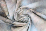 Swirled swatch mist fabric (pale blue/grey marbled fabric with faint grey, black, olive tree silhouettes and a misty look)