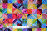 Flat swatch Hoffman Wave: Rainbow fabric (rainbow coloured fabrics in quilt squares/patchwork design allover)